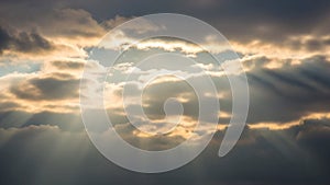 Clouds in a dramatic display of crepuscular rays adding depth and