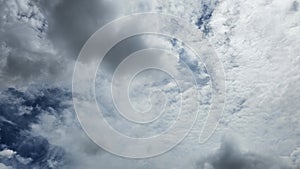 The clouds are fluffy and white against a backdrop of deep blue. photo