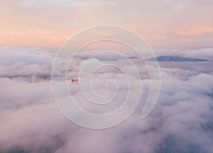 Clouds flying above the city during sunset