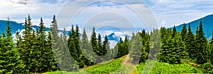 Clouds and fog covered mountain peak photo