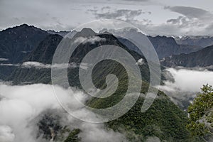 Clouds and fog on the Inca Trail to Machu Picchu. A awesome hiking trail with hight mountain pass and mountain ranges. Green Fore