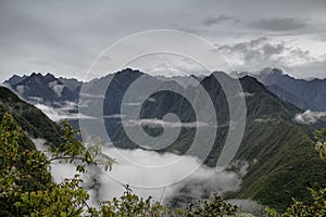 Clouds and fog on the Inca Trail to Machu Picchu. A awesome hiking trail with hight mountain pass and mountain ranges. Green Fore