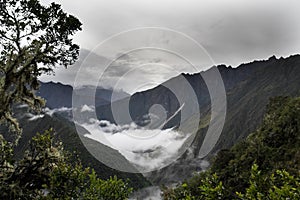 Clouds and fog on the Inca Trail to Machu Picchu. A awesome hiking trail with hight mountain pass and mountain ranges. Green Fore