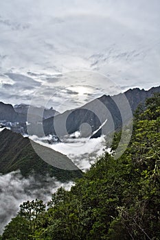 Clouds and fog on the Inca Trail to Machu Picchu. A awesome hiking trail with hight mountain pass and mountain ranges. Green Fore