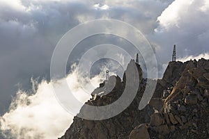 Clouds and fog near Aiguille du Midi. View from the Cosmique refuge, Chamonix, France. photo