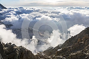 Clouds and fog over the Chamonix valley. View from the Cosmique refuge, Chamonix, France. photo