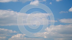 Clouds form against brilliant blue sky. Beautiful colors, fluffy summer, sunny lightness cloudscape.