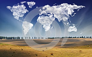 Clouds in the form of a map of the world over the field. Travel and landscape concept