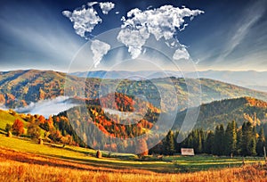Clouds in the form of a map of the world over the mountains. autumn dawn in the Carpathians