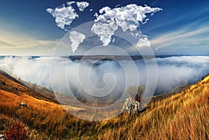 clouds in the form of a world map over the river canyon. Travel and landscape concept