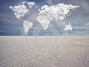 Clouds in the form of a world map over a winter field. travel and landscape concept