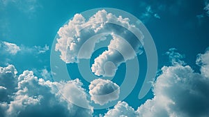 Clouds forming a question mark in a bright blue sky.