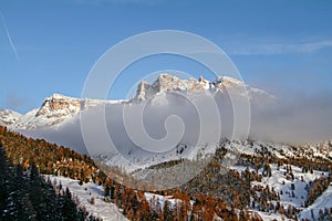 Clouds in front of Pela the Vit, beautiful Mountina in the Dolomites, located in Valgardena, South Tirol. Winter Landscape with