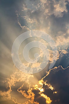 Clouds and golden sunbeam