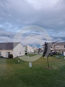 Clouds on the horizon of townhome houses photo