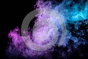 Clouds of isolated colored smoke: blue, red, green, pink; scrolling on a black background