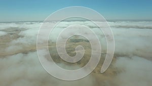 Clouds, landscape and sand with desert from airplane view for nature, adventure and environment. Discovery, journey and