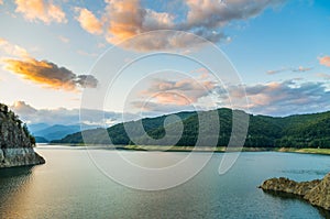 Clouds and mountain lake