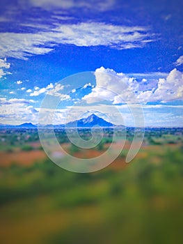 The clouds and mountain are nature