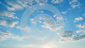 Clouds move in the blue sky. Tropical sky at day time, only white and blue colors. Semi-transparent layers on different