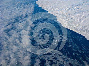 Clouds, ocean and Greenland coastline