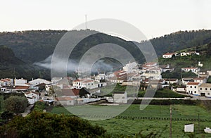 Clouds over Small Village - Sunrise Mountain Scene photo