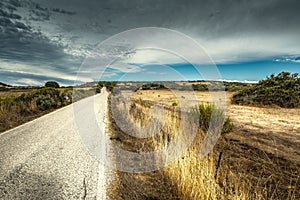 Clouds over a country road in Sardinia