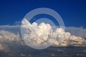 Compact clouds over a dark blue sky photo
