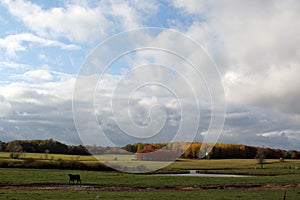 Clouds over farmland in fall