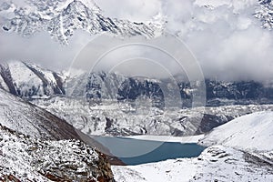 Clouds over glacier and Dudh Pokhari mountain lake, Himalaya