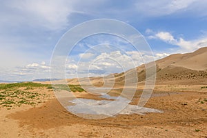 Clouds over the Gobi desert, dune Hongoryn, Mongolia