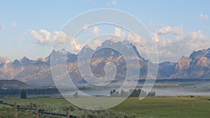 Clouds over the Grand Teton mountains at sunrise