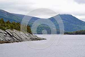 Clouds over hilly coastal landscape along Bonne Bay at Norris Point