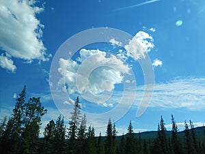 Clouds over the mountains in the sunlight.