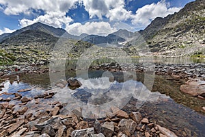 Clouds over Musala peak and reflection in Musalenski lakes, Rila mountain