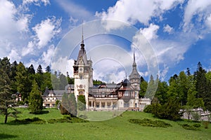 Clouds over Peles castle in Sinaia, Romania, during Spring. Popular sightseeing destination, tourism, architecture