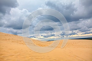 Clouds over sandy duna photo