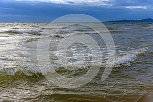 Clouds over the sea and waves