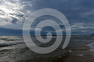 Clouds over the sea and waves