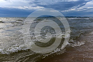 Clouds over the sea and waves