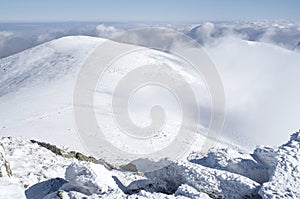 Clouds over snow winter mountain, Bulgaria