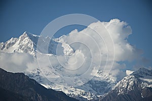 Clouds over the snowcapped mountains, Himalayas, Uttarakhand, In photo