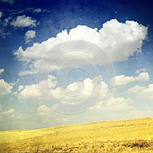 Clouds Over Yellow Fields (grunge image)