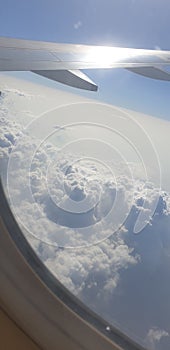 Clouds pattern from aeroplane window in white colour with peace