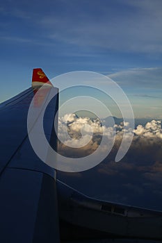 Clouds and plane wing