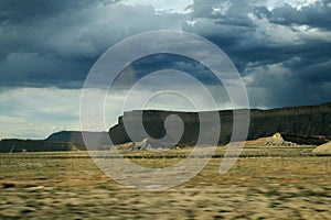 Clouds and rain near the sandy hills of Utah in America.