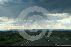 Clouds and rain over a highway in the state of utah, USA.