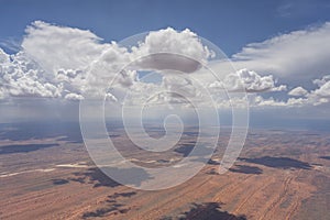 clouds and rain shower on dune stripes of Kalahari, east of Kalkrand, Namibia