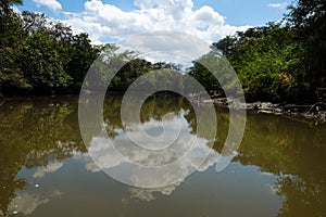 Clouds Reflected on Tempisque River. photo