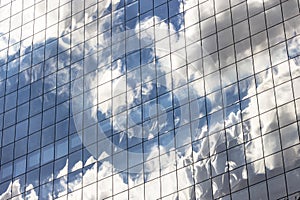 Clouds Reflected in Windows of Modern Office Building